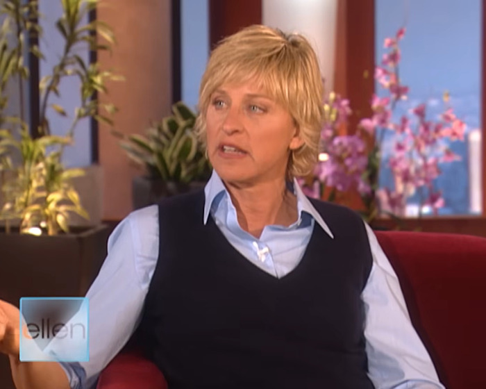 Ellen DeGeneres speaking during a talk show interview, with plants and flowers in the background. Ellen DeGeneres speaking during a talk show interview, with plants and flowers in the background.