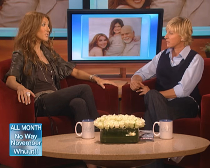 Céline Dion and Ellen DeGeneres in a TV interview setting with family photo displayed on screen behind them. Céline Dion and Ellen DeGeneres in a TV interview setting with family photo displayed on screen behind them.