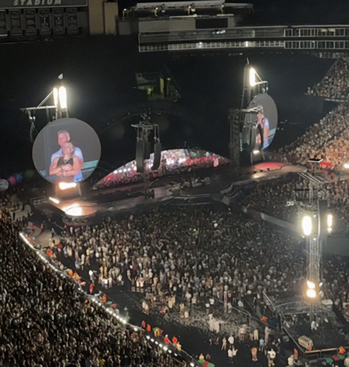 Large crowd at a concert venue with stage screens showing performers, highlighting viral HR executive news after marriage revealed. Large crowd at a concert venue with stage screens showing performers, highlighting viral HR executive news after marriage revealed.