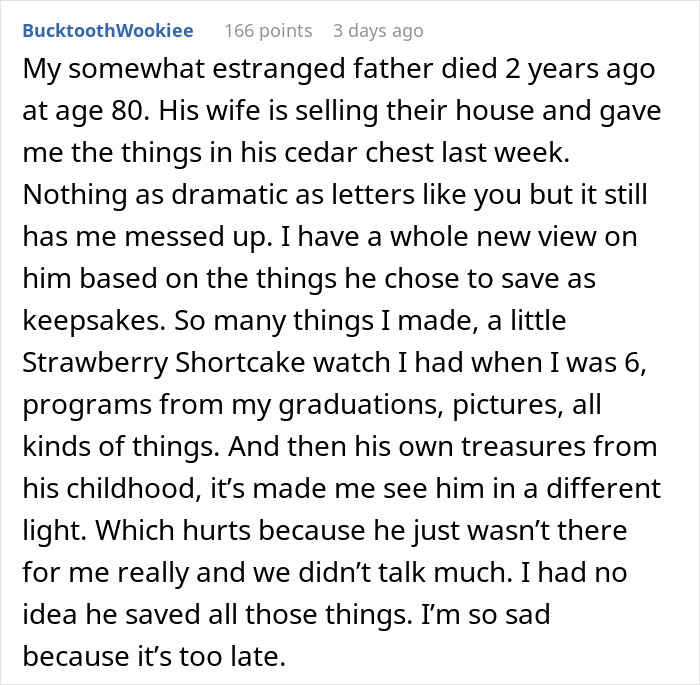 Man reflecting thoughtfully while sorting through keepsakes in a storage unit left by his dad in a will.