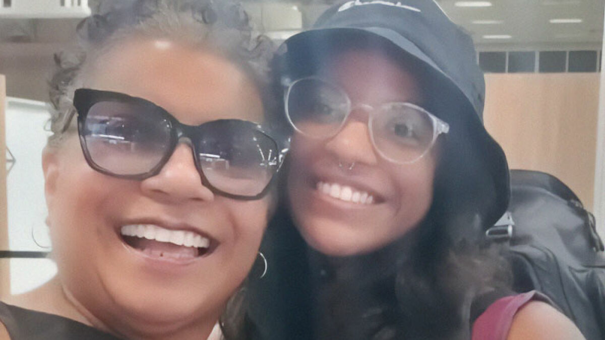Mother and daughter smiling together, highlighting the hiker abandoned inside an active volcano by her guide.