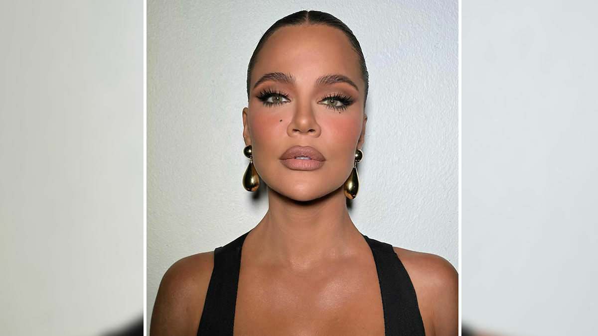 Khlou00e9 Kardashian close-up portrait with makeup, showcasing beauty and cosmetic procedures on a plain background.