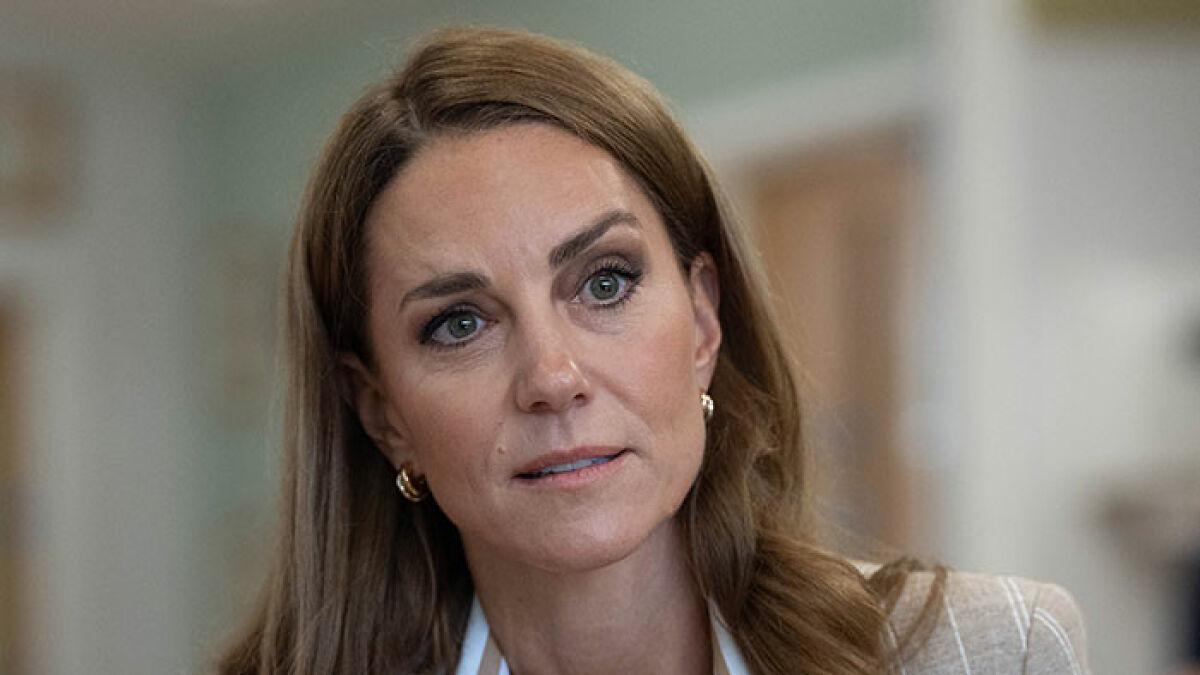 Kate Middleton speaking candidly about cancer, looking serious and thoughtful in an indoor setting.