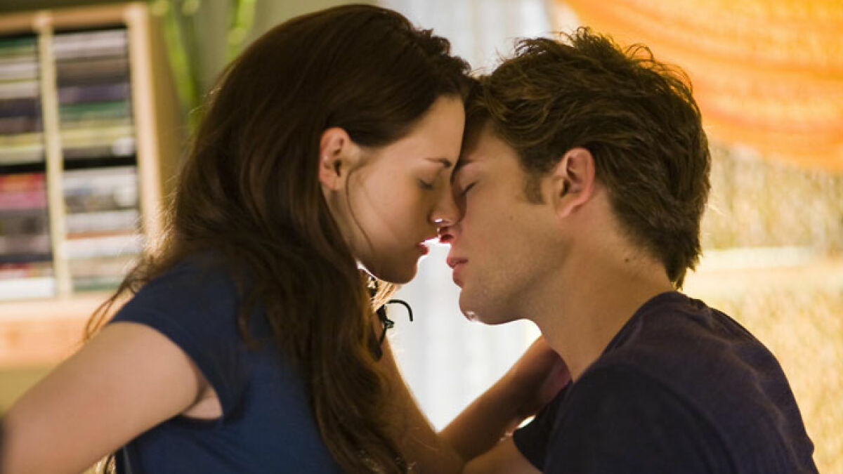 Robert Pattinson and co-star in an intimate Twilight scene, showcasing emotional and challenging film moment.