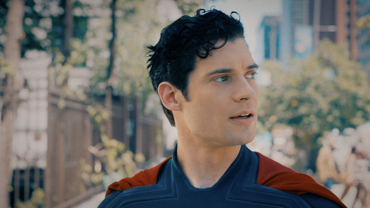 Actor as Superman in a reboot film wearing costume outdoors reflecting the woke Superman reboot in early reviews.