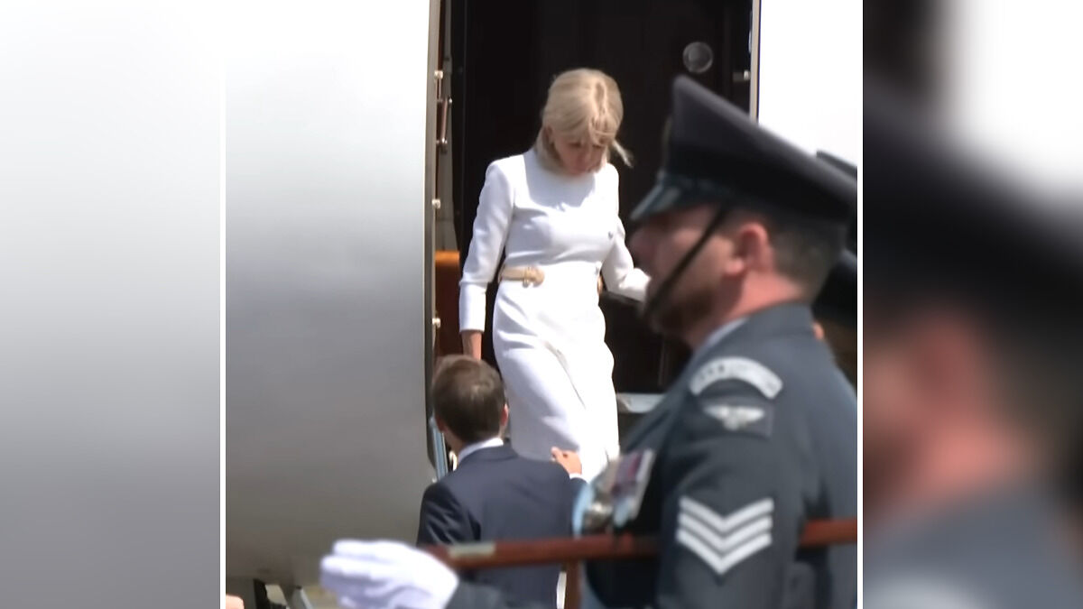 Brigitte Macron walking down airplane stairs, showing cold behavior towards husband during UK visit.