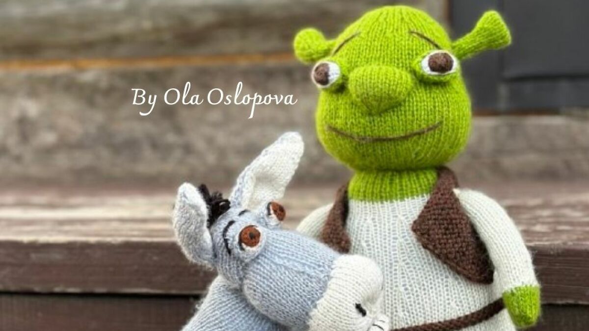 Knitted figures of Donkey and Shrek sit together as a representation of Donkey as Shrek's best friend.