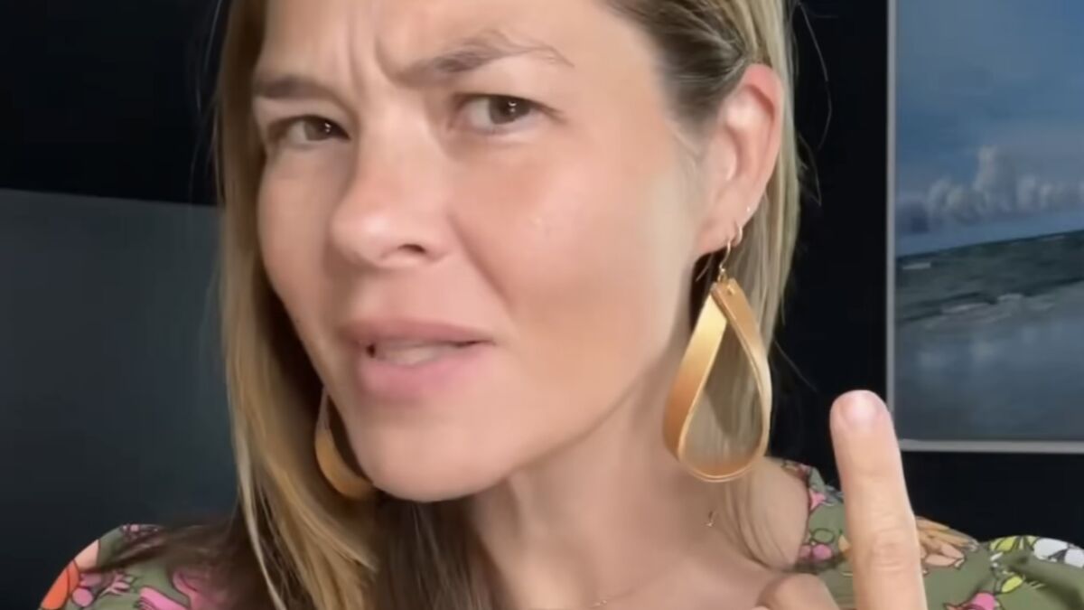 Woman with large gold earrings raising finger, warning parents about disturbing new meaning of the word bop