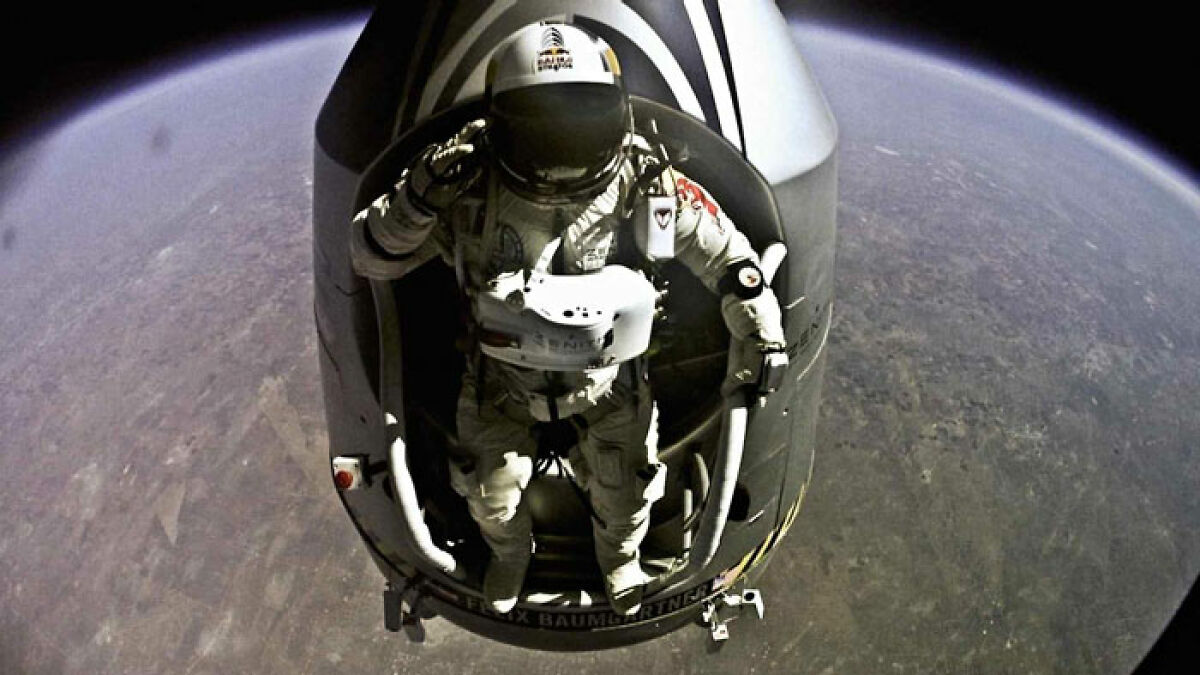Astronaut exiting spacecraft in space suit, showcasing extreme daredevil skydiver preparing for viral mid-air jump.