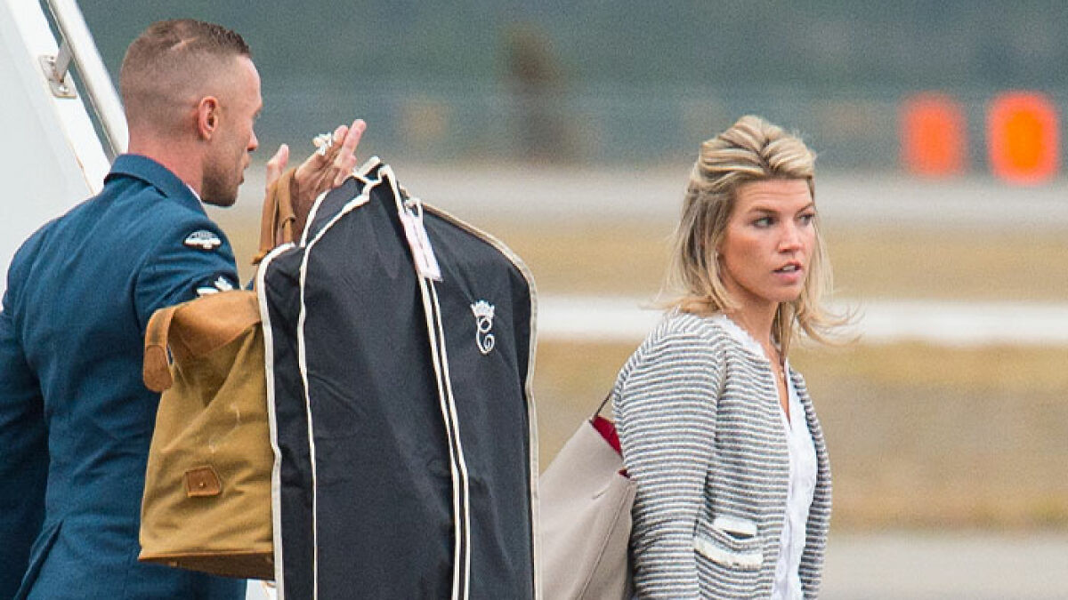 Kate Middletonu2019s ex-assistant walking with luggage, taking a subtle jab at Meghan Markle before stepping down.