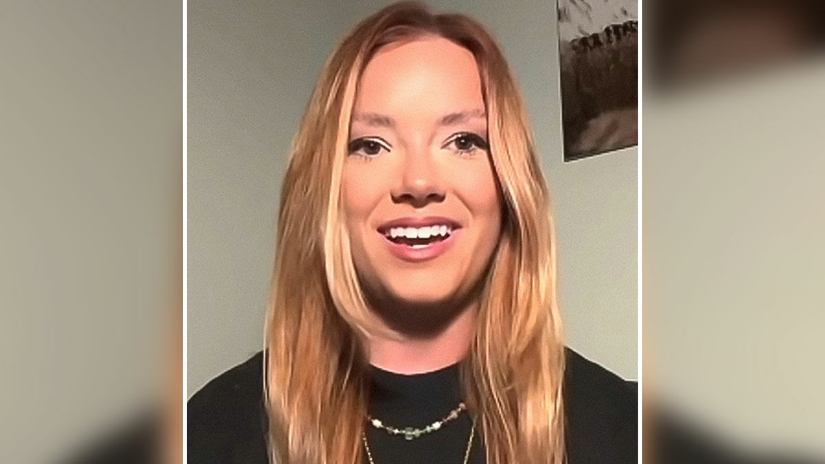 Young woman with long blonde hair smiling during an interview about CEO cheating on Coldplay kiss cam viral incident.