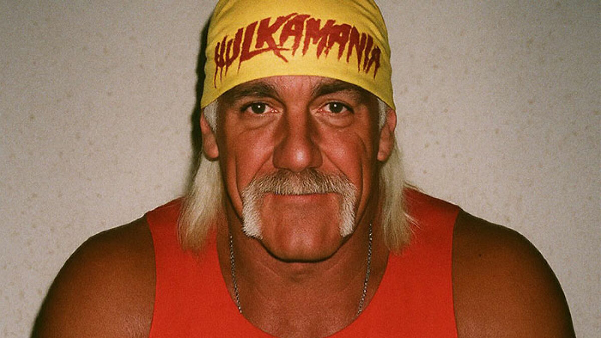 Hulk Hogan wearing yellow Hulkamania bandana and red tank top, WWE legend portrait focused on his face.