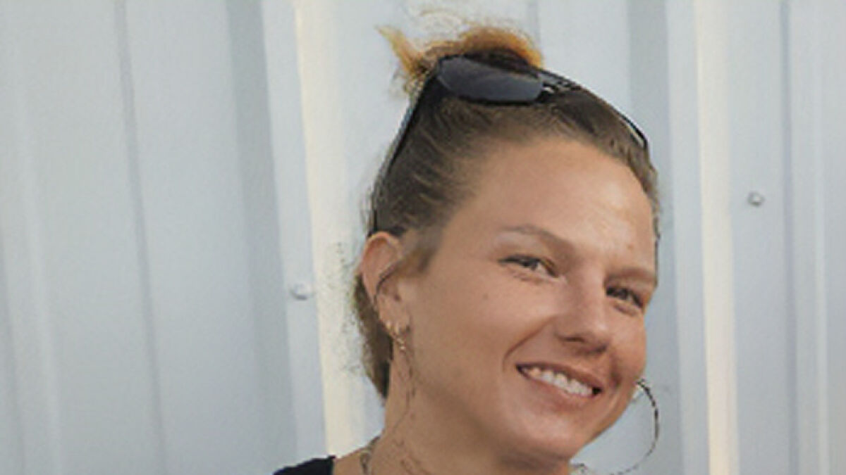 Smiling woman with sunglasses on her head, representing the woman who mysteriously vanished in Death Valley found after 9 months.