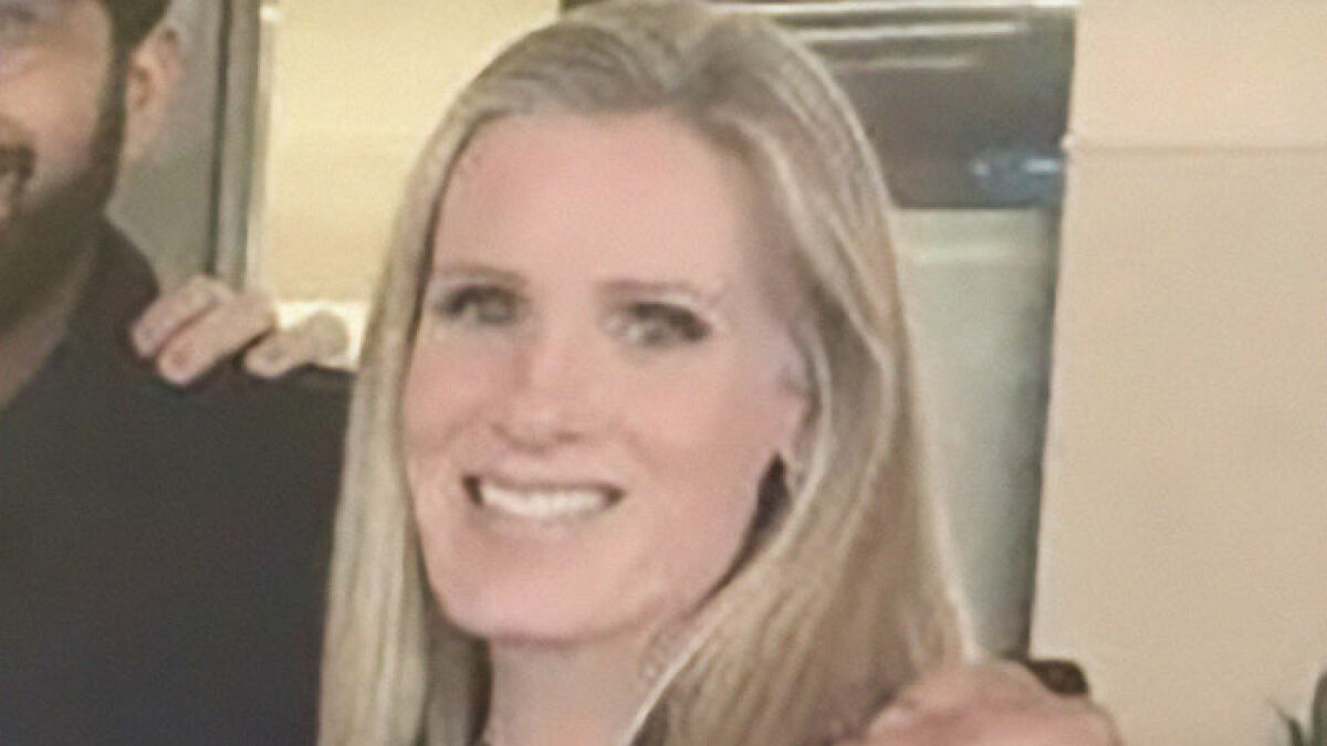 Blonde woman smiling at a casual indoor gathering, related to viral HR executive quitting job after marriage news.