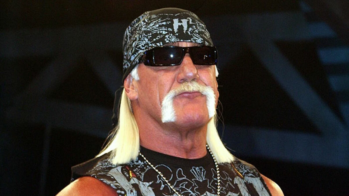 Hulk Hogan wearing sunglasses and bandana at a press conference about pro wrestler's final moments and 911 call.
