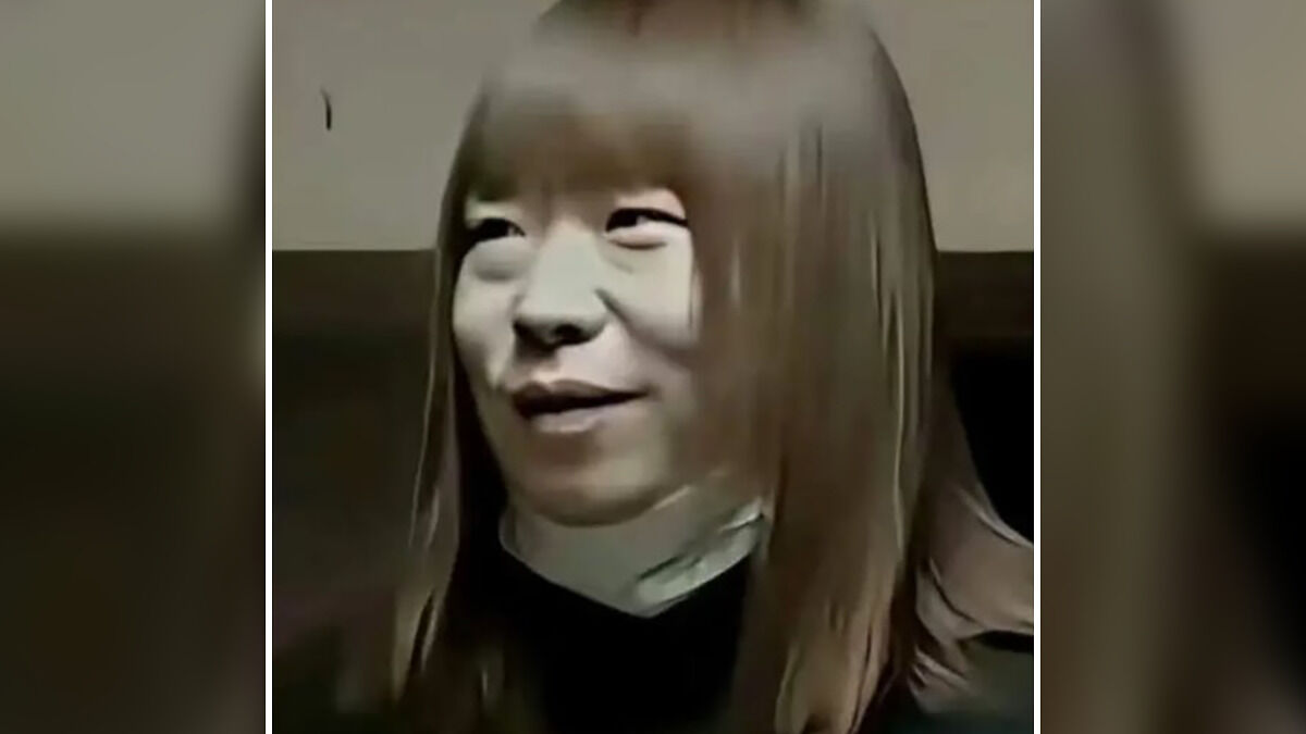 Person posing as woman with straight brown hair and mask under chin, linked to viral predator secretly filming encounters.