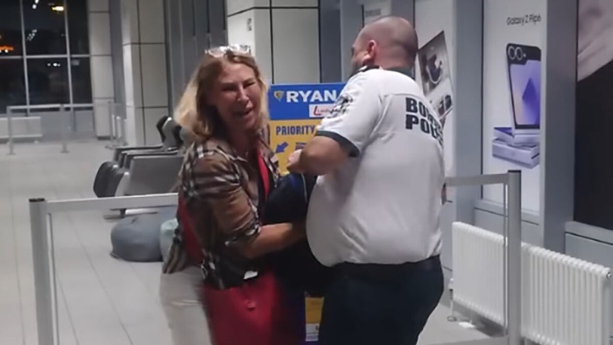 Woman having a dramatic meltdown at airport after being denied boarding by Ryanair over luggage size dispute.