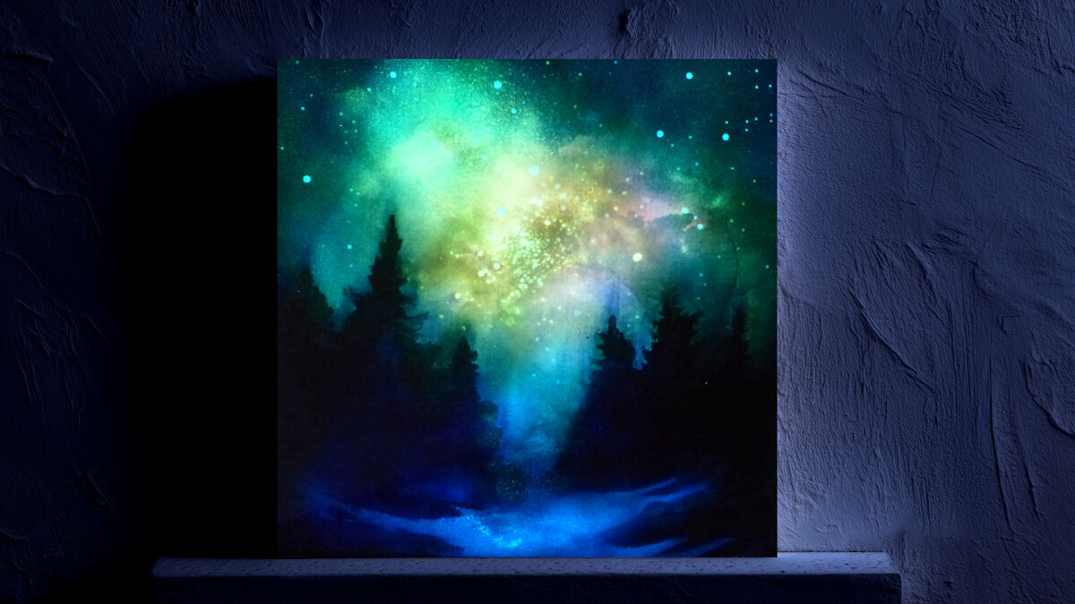 Glow in the dark starry night sky painting with glowing stars and silhouettes of trees under a vibrant galaxy backdrop