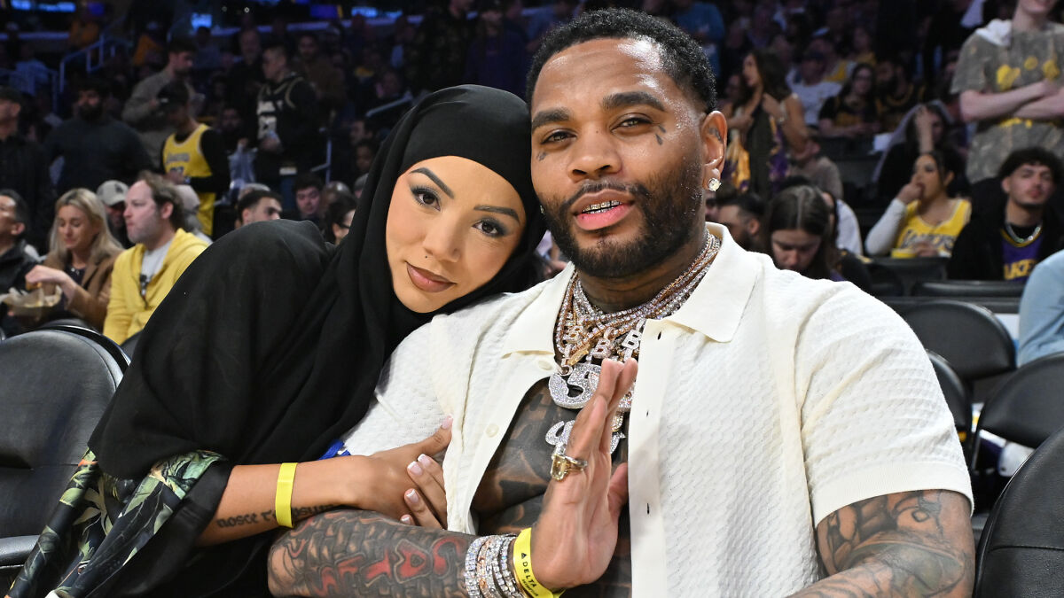 Influencer wearing hijab with man at a basketball game, highlighting contrast before and after raunchy makeover controversy.