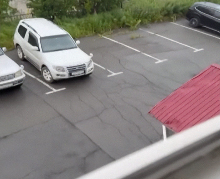Parking lot with visible cracks in the pavement showing ground shifts after first tsunami waves slam into Alaska and Japan. Parking lot with visible cracks in the pavement showing ground shifts after first tsunami waves slam into Alaska and Japan.