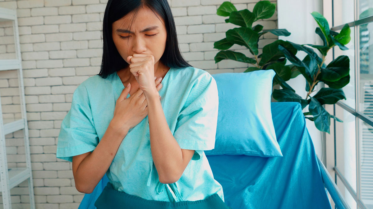 Patient coughing and clutching chest, illustrating doctors' experiences with impostor patients needing less medication.