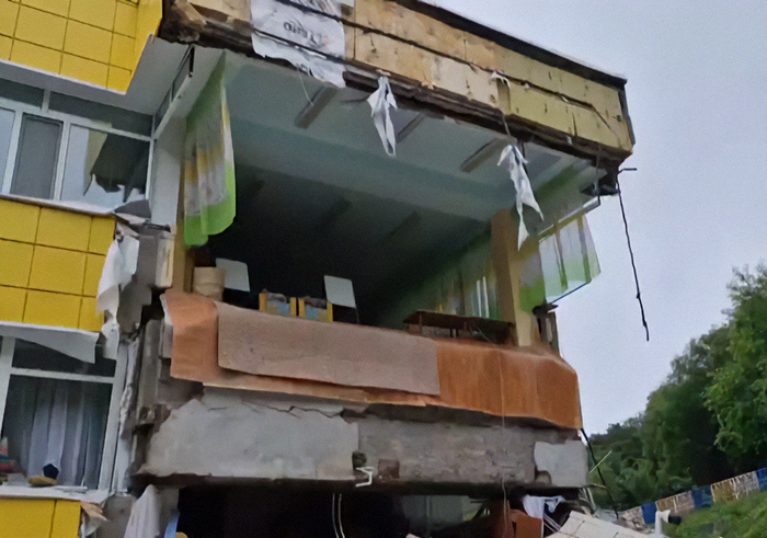 Damaged building with exposed interior after tsunami waves slam into Alaska and Japan following mega earthquake warnings. Damaged building with exposed interior after tsunami waves slam into Alaska and Japan following mega earthquake warnings.