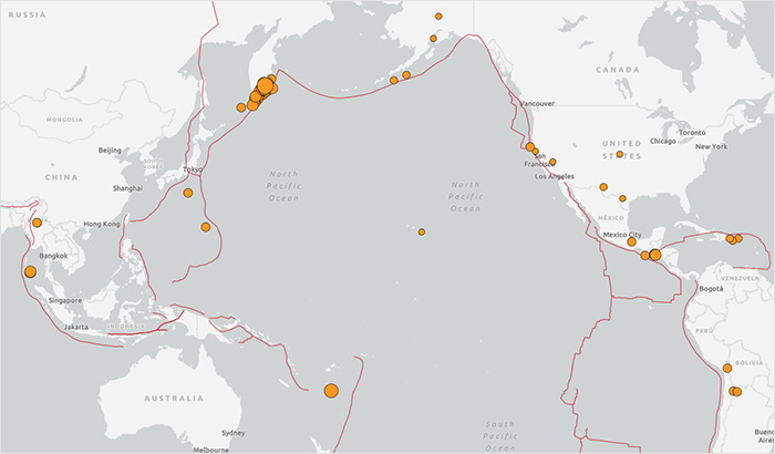 Map showing first tsunami waves hitting Alaska and Japan after major earthquake, with seismic activity marked across Pacific Rim. Map showing first tsunami waves hitting Alaska and Japan after major earthquake, with seismic activity marked across Pacific Rim.