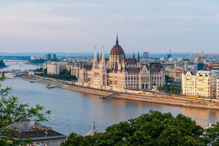 Panoramic view of one of the smartest countries with historic architecture along a river shaping the future of the world.