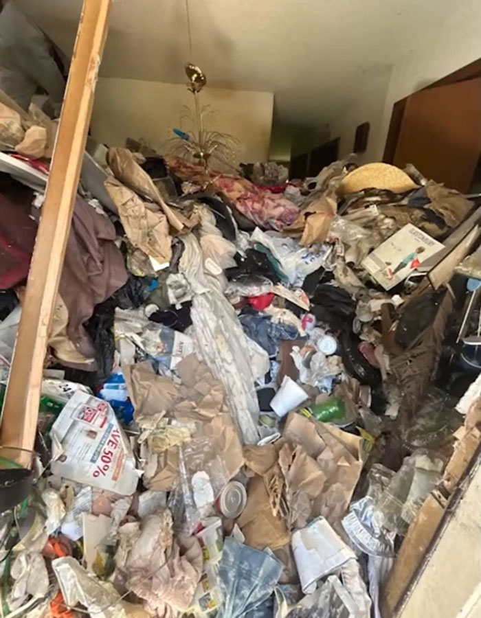 Cluttered hoarder house filled with trash and debris where police discovered skeletal remains of ex-cop. Cluttered hoarder house filled with trash and debris where police discovered skeletal remains of ex-cop.