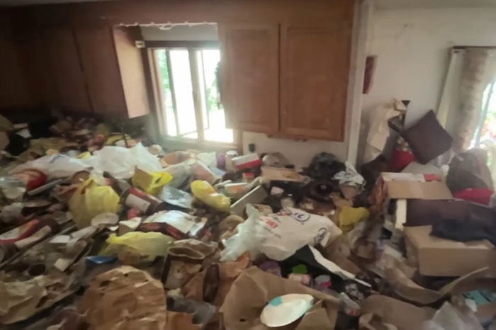 Cluttered room filled with trash and debris, scene of police discovering skeletal remains in hoarder ex-cop’s house. Cluttered room filled with trash and debris, scene of police discovering skeletal remains in hoarder ex-cop’s house.