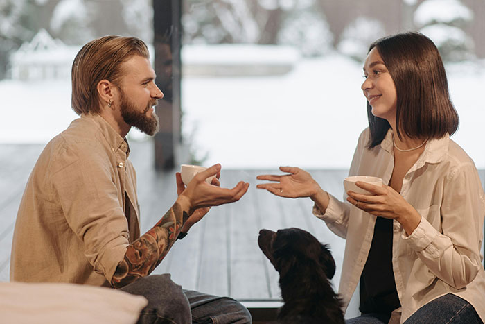 Woman meets up with ex after years apart, discussing co-parenting his secret child over coffee at home. Woman meets up with ex after years apart, discussing co-parenting his secret child over coffee at home.