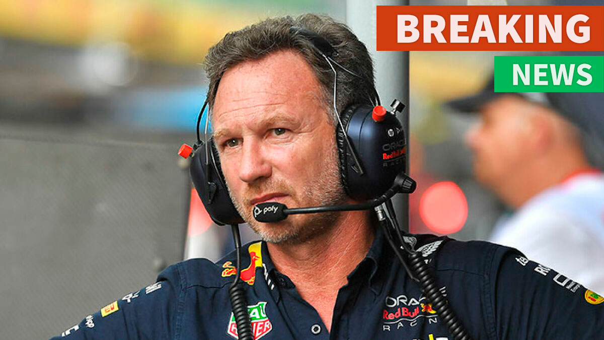 Christian Horner wearing Red Bull headset during a Formula 1 event, representing F1 legend in racing management.