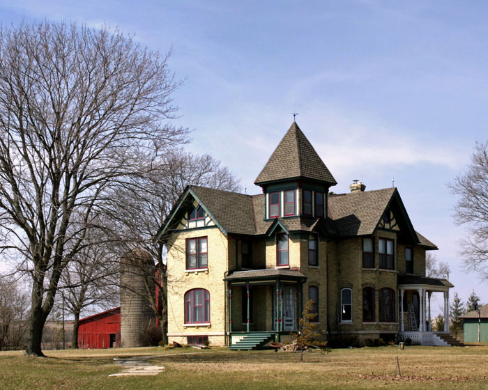 Large old house under clear sky with bare trees, suggesting a home remodel and contractor quotes for renovation. Large old house under clear sky with bare trees, suggesting a home remodel and contractor quotes for renovation.