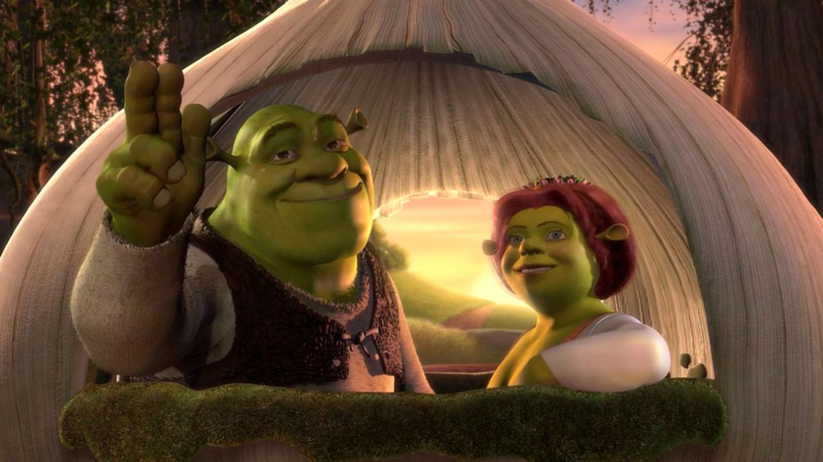 Shrek and Fiona in front of their home, smiling and waving in a scene from an animated movie for social media humor.