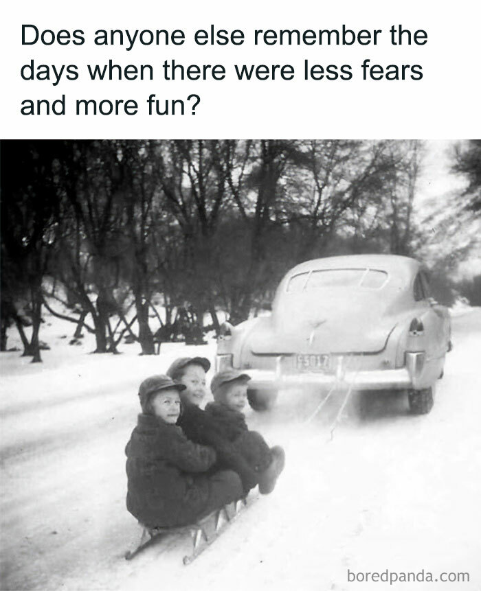Three children sledding behind a vintage car in snowy landscape, evoking nostalgia and good old days memories.