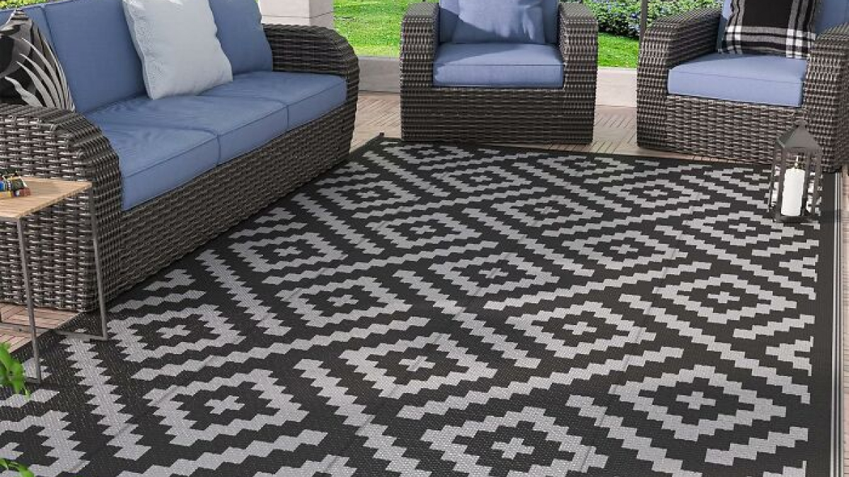 Outdoor patio set with blue cushions and geometric patterned rug, one of the favorite home finds for Prime Day.