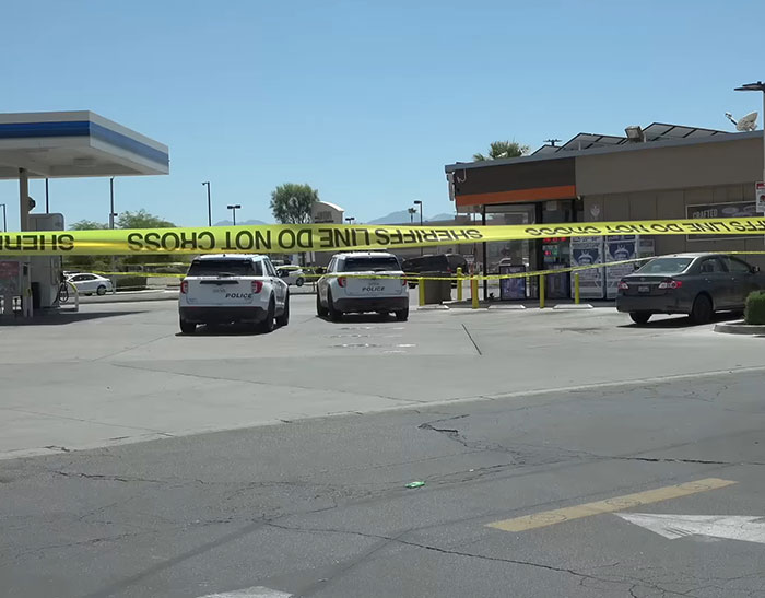 Police vehicles parked outside a convenience store with yellow crime scene tape surrounding the area after a horrifying teddy bear discovery. Police vehicles parked outside a convenience store with yellow crime scene tape surrounding the area after a horrifying teddy bear discovery.