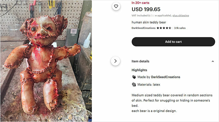 Teddy bear covered in apparent human remains displayed on a worn workbench in a workshop setting. Teddy bear covered in apparent human remains displayed on a worn workbench in a workshop setting.