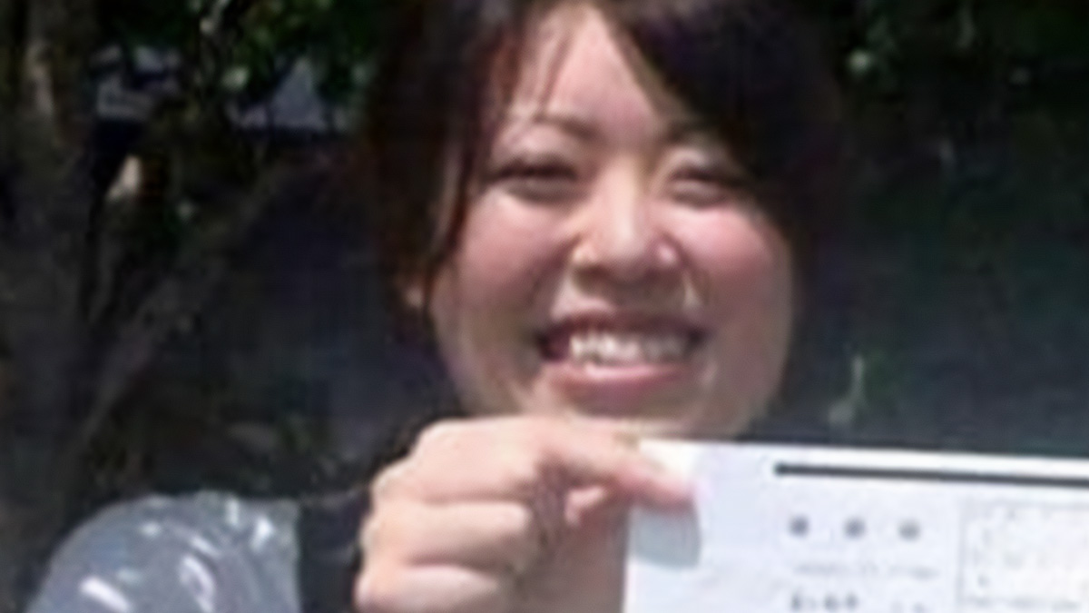 Smiling person holding a paper outdoors in a casual setting, related to horror pill online group images.