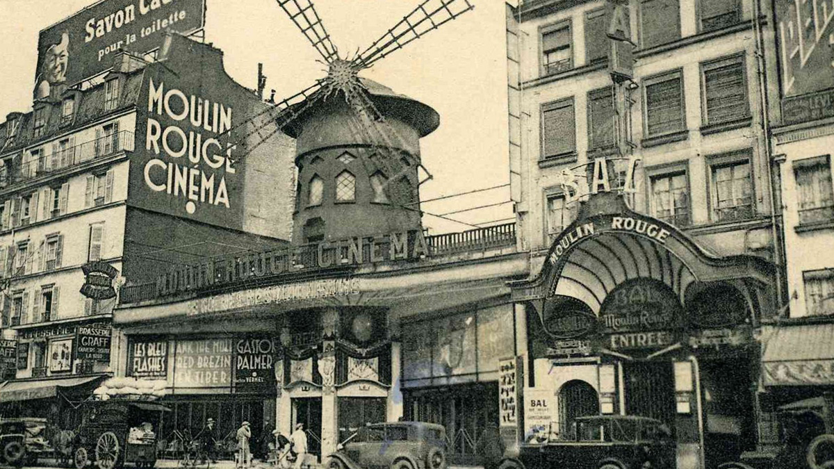Vintage photo of Moulin Rouge cinema and surrounding buildings showing Father Timeu2019s effect on the world around us.