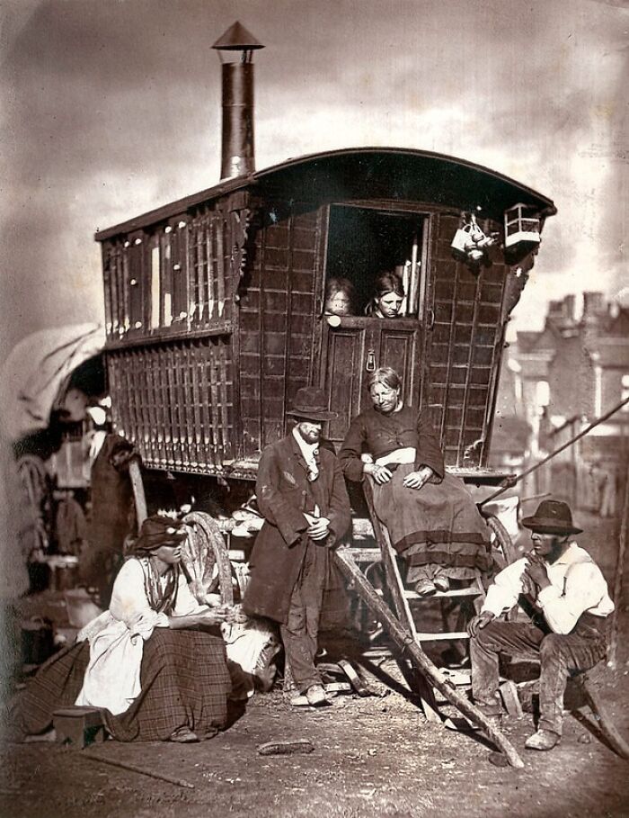 London's poorest family outside a wooden caravan home in the 1800s, showing how London's poorest really lived.