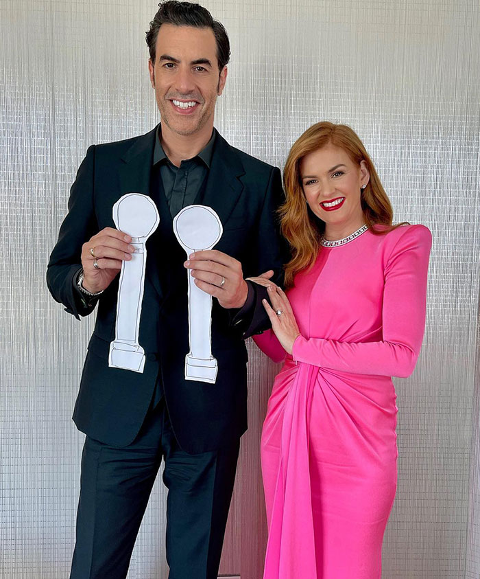 Isla Fisher and Sacha Baron Cohen posing together, Isla wearing a pink dress and sharing a message about marriage. Isla Fisher and Sacha Baron Cohen posing together, Isla wearing a pink dress and sharing a message about marriage.