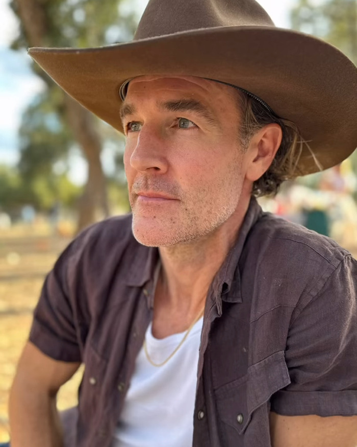 James Van Der Beek wearing a brown hat and dark shirt outdoors, reflecting on difficult moments with kids during cancer journey. James Van Der Beek wearing a brown hat and dark shirt outdoors, reflecting on difficult moments with kids during cancer journey.