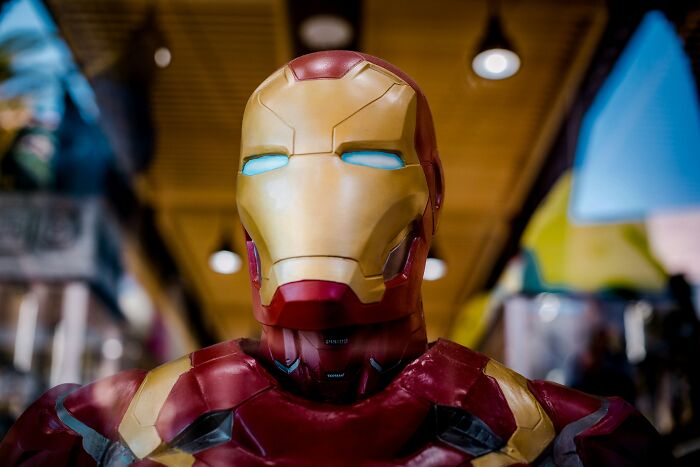 Iron Man costume close-up in a vibrant setting, illustrating creativity for outrageous student names topic.