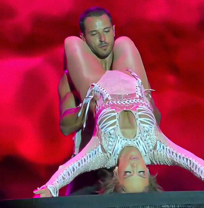 Jennifer Lopez performing raunchy dance moves with a male dancer in a controversial and provocative show. Jennifer Lopez performing raunchy dance moves with a male dancer in a controversial and provocative show.