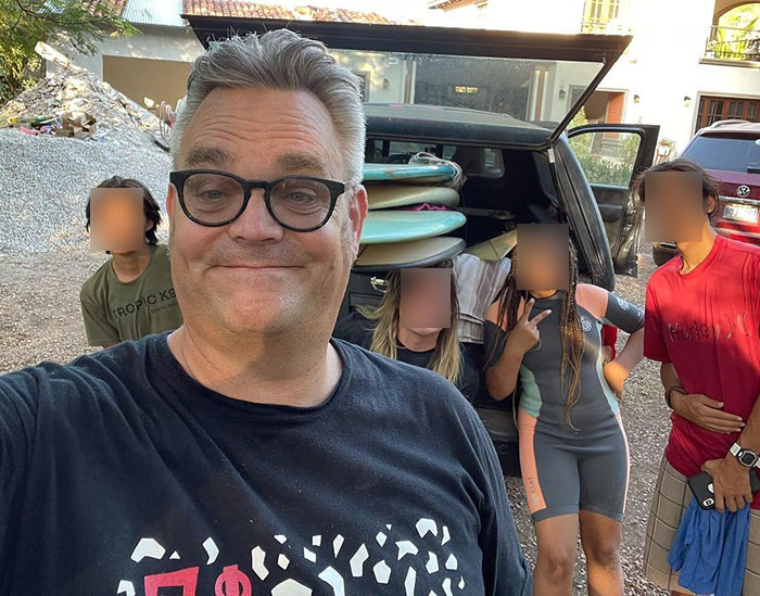 White foster dad with children near a car, related to allegations by United Airlines crew involving Latina daughters trafficking. White foster dad with children near a car, related to allegations by United Airlines crew involving Latina daughters trafficking.