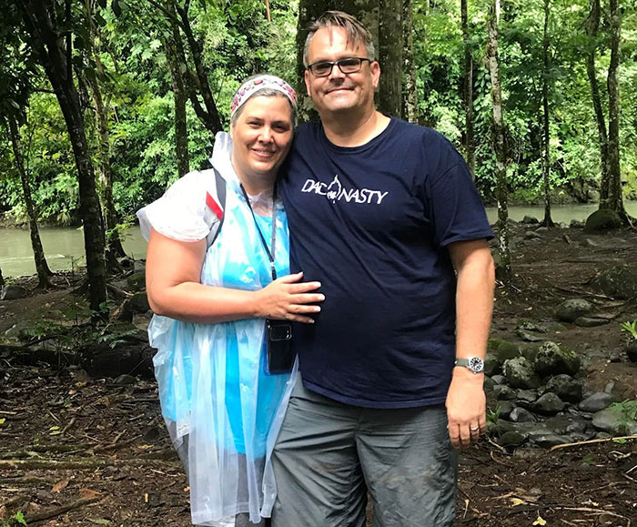 White foster dad and woman standing in forest near river, related to trafficking accusations by United Airlines crew. White foster dad and woman standing in forest near river, related to trafficking accusations by United Airlines crew.
