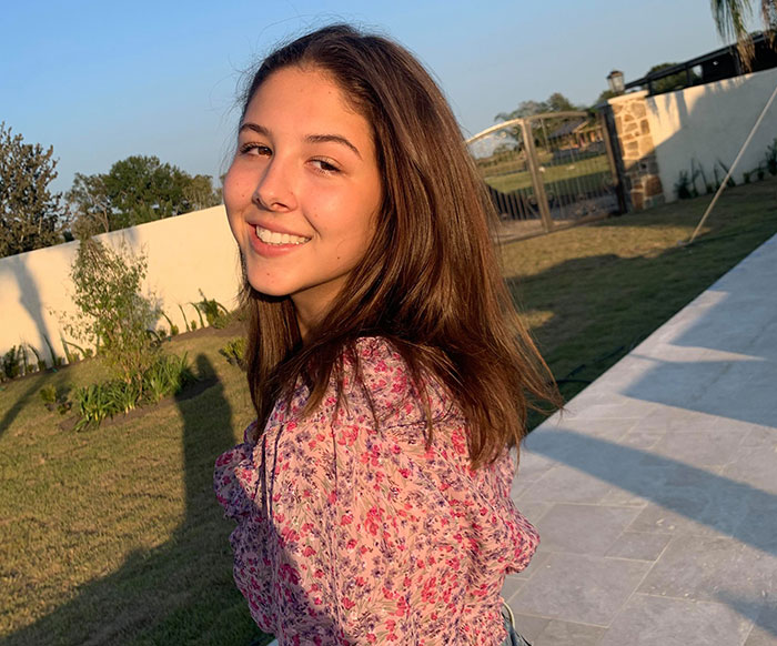 Smiling young flood victim outdoors at sunset, capturing the fear and emotion behind the final message shared. Smiling young flood victim outdoors at sunset, capturing the fear and emotion behind the final message shared.