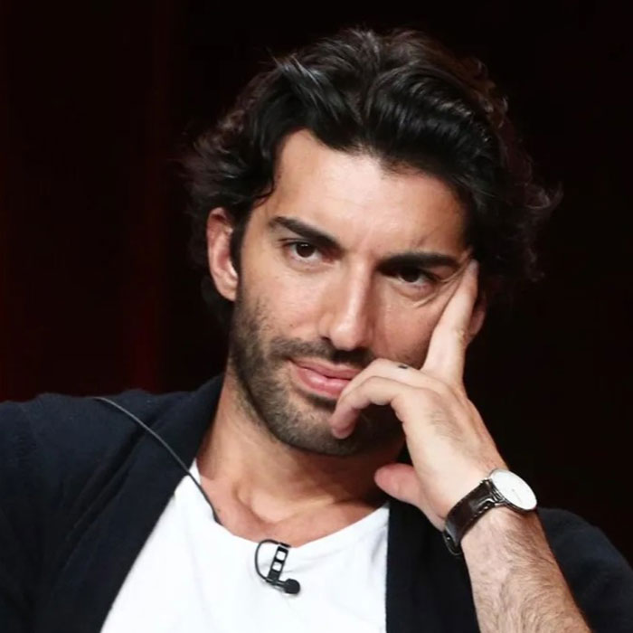 Man with dark hair wearing a watch, resting his head on hand, reflecting on Blake Lively given reality check in court. Man with dark hair wearing a watch, resting his head on hand, reflecting on Blake Lively given reality check in court.