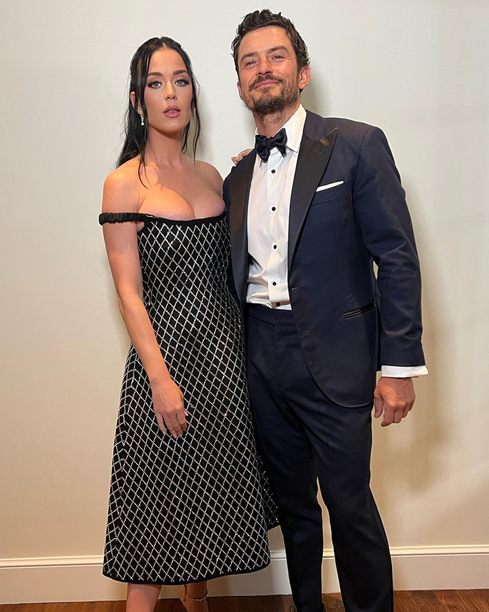 Katy Perry and Orlando Bloom dressed formally, posing together in an indoor setting amid breakup news after six years engagement. Katy Perry and Orlando Bloom dressed formally, posing together in an indoor setting amid breakup news after six years engagement.